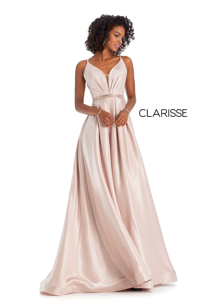 Clarisse 8088 Blush is a long a-line prom dress with a pleated v-neck bodice, beaded belt, side pockets, and adjustable crossing back straps, made in shimmering satin.