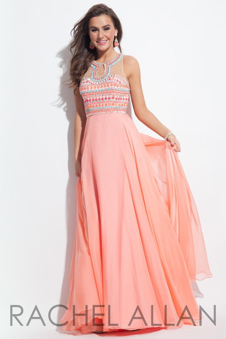 Flowing Coral chiffon a-line dress featuring an illusion sweetheart neckline with beaded accents of coral, white and turquoise and beaded straps across the back.