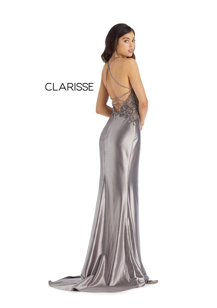 Clarisse 8061 Metallic Silver is a fitted long prom dress with a v-neck sheet beaded bodice, a metallic stretch jersey skirt with a front slit, and a strappy open back.