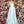 Clarisse 8105 shown in Seafoam is a long a-line prom dress with a low scoop neckline, open lace up back, side pockets, and a cross over high slit skirt.