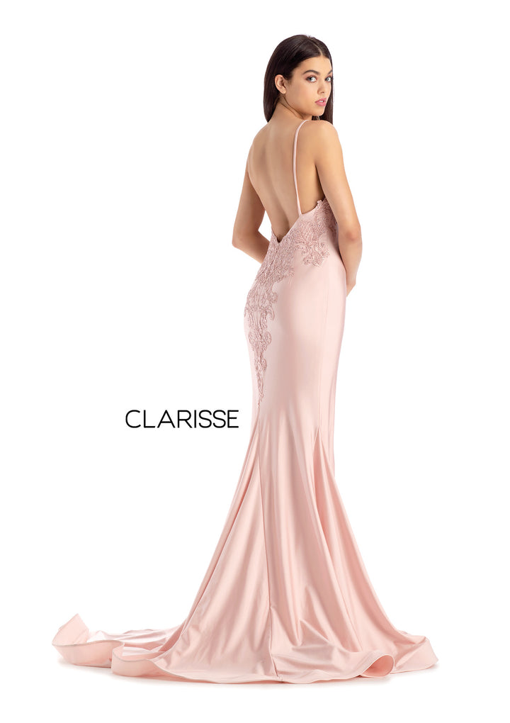Clarisse 8207 is a long fitted prom dress with a deep v neck bodice embellished with lace appliques, and an open lace up back, made in silky stretch knit fabric with a dramatic long train. Shown in Blush