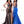 Envious Couture E1741 in Coco by Karishma Creations is a full length shimmering bronze tone Prom Dress featuring a plunging halter neckline with criss cross back detail. A fit-n-n-flare silhouette with a high slit and sweet train. 
