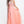 Flowing Coral chiffon a-line dress featuring an illusion sweetheart neckline with beaded accents of coral, white and turquoise and beaded straps across the back.