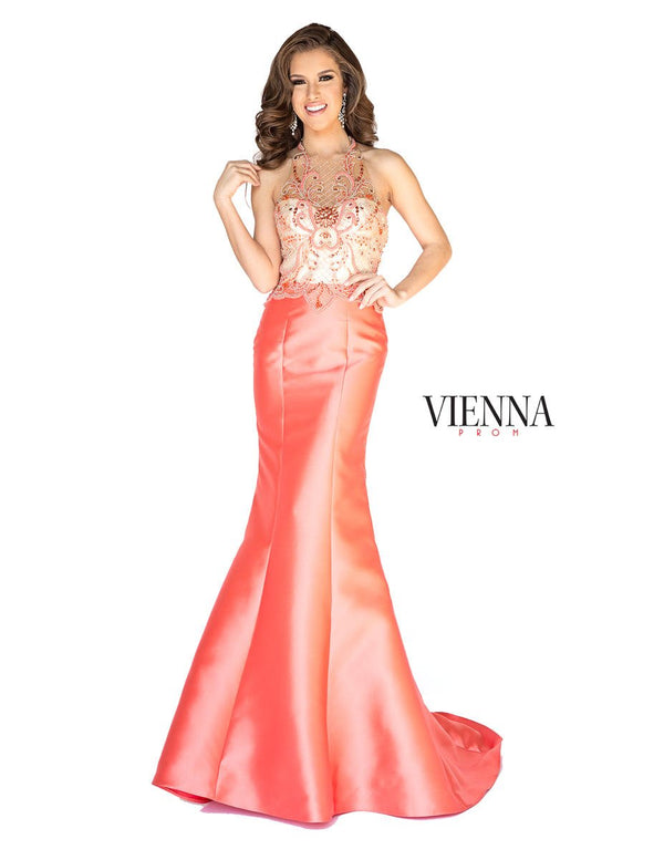 Exquisitely beaded nude illusion bodice with halter neckline completes the sleek silhouette and fitted Blue mikado mermaid skirt.